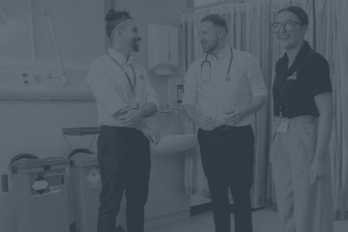 Sharpsmart employees talking and smiling with healthcare worker