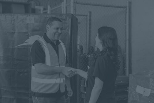 Nurse and Sharpsmart staff shaking hands