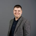 Portrait headshot of contrract manager in suit